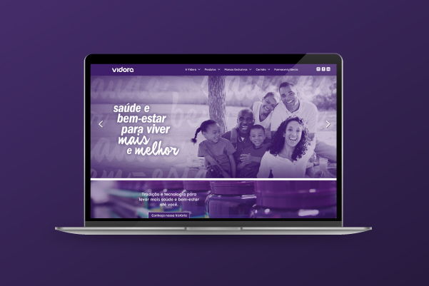 Project cover for Vidora Website: notebook screen showing a mainly purple website main page