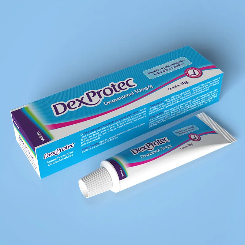 'Dexprotec' dexpanthenol cream package in a blue and white box and tube on a light blue surface.