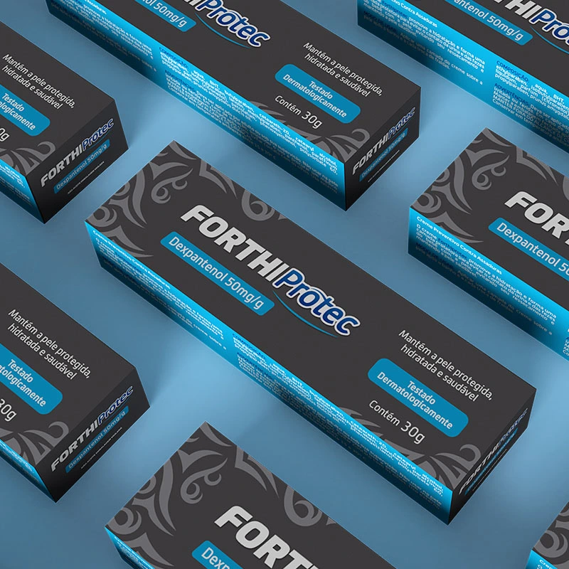Repetitive, close-up pattern of black and blue boxes of 'FORTHIProtec' Dexpantenol cream at an angle on a light blue background