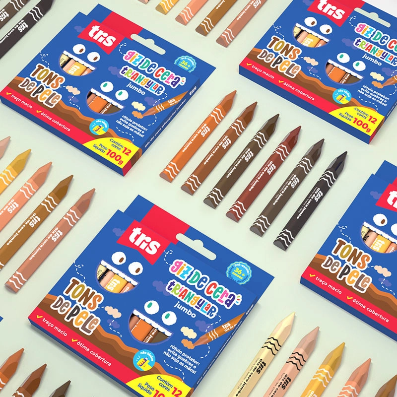 Close-up product shot of multiple packages of 'Skin Tones' jumbo triangular crayons in shades of brown, tan, and black, displayed with individual crayons scattered around them.