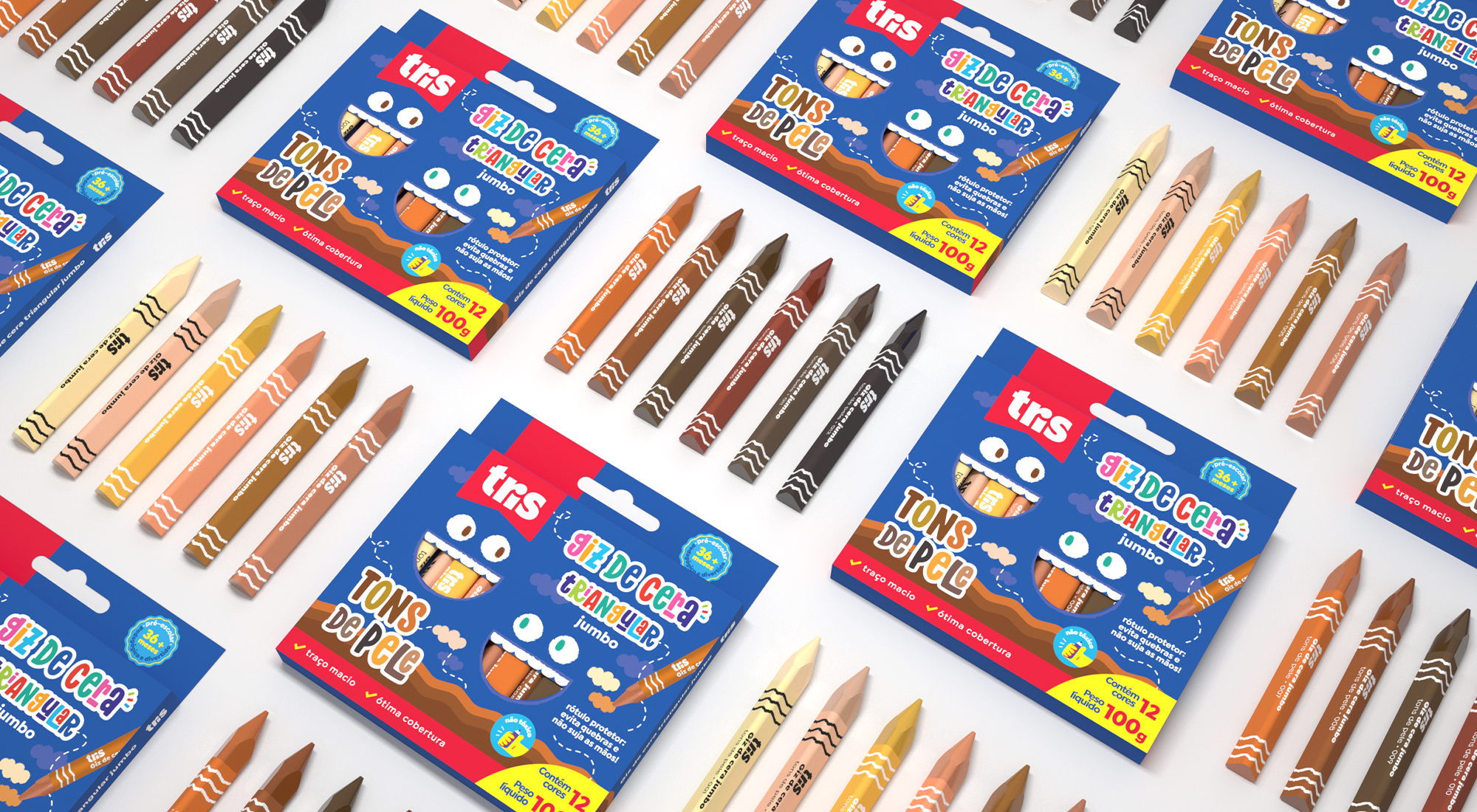 wall of crayons of skin colors laying on a white table alongside the crayon packaging.